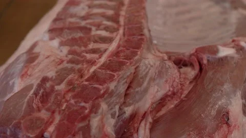 Half Pork Carcass on the table Stock Footage 137900731