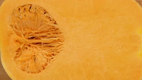 Half a pumpkin, dolly shot. Pumpkin with seeds. Stock Footage 140040861