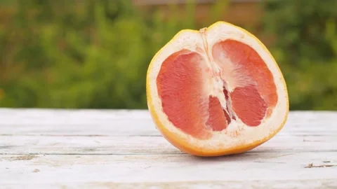 Half of red orange moving along the table Stock Footage 141602051