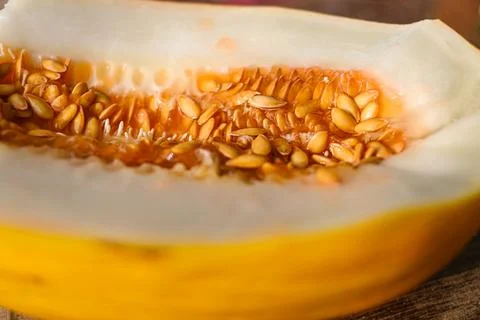 Half of ripe melon with seeds close-up Stock Photos