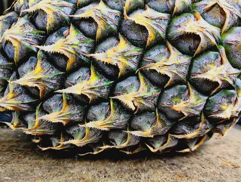 Half of Ripe Pineapple on the Floor, Front View Stock Photos