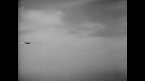 A half roll aerial maneuver is demonstrated in a simulated dogfight with fighter Stock Footage