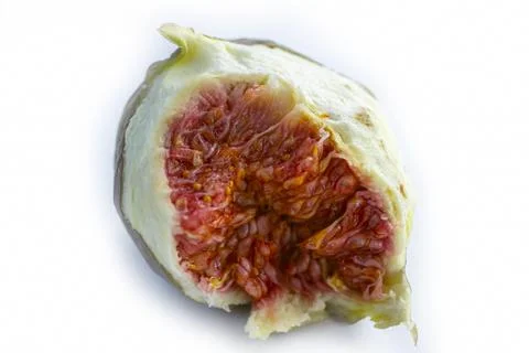 A half slice of fig on white background Stock Photos