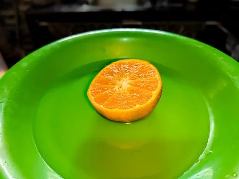 Half a slice of orange Stock Photos