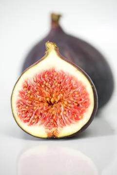 Half sliced fig studio shot Stock Photos