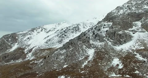 Half Snow Covered High Mountain Chain, Winter Day, 4k Aerial View Stock Footage 171242847