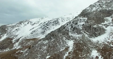 Half Snow Covered High Mountain Chain, Winter Day, 4k Aerial View, Long Shot Stock Footage 171242859