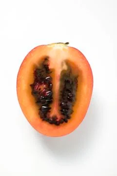 Half a tamarillo (overhead view) Stock Photos