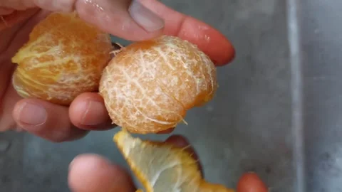 Half a tangerine, peeled Stock Footage 264811907