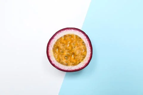 Half of tasty fresh passion fruit (maracuya) on color background, top view Stock Photos