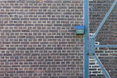 Half timbered brick wall with a lamp Fotos Stock