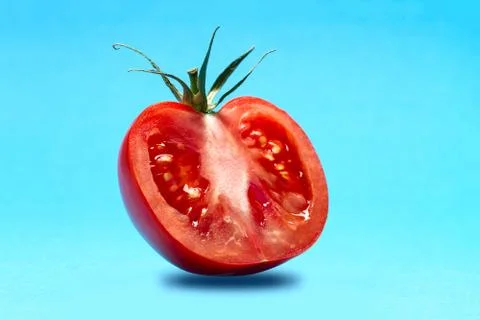 Half A Tomato Levitates Stock Photos
