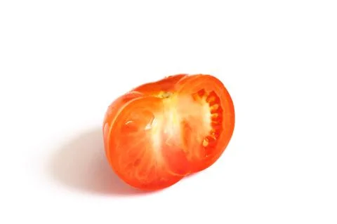 Half a tomato on a white background Stock Photos