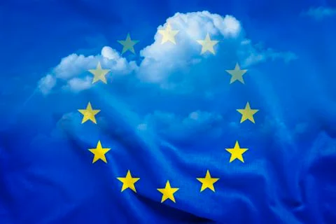 Half-transparent EU flag with white clouds Stock Photos
