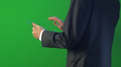 Half-Turned Man Back to Camera Clicks Tablet Buys Through Internet Working on Stock Footage 60439444