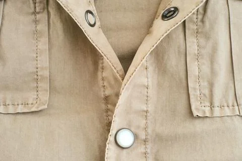 A half unbuttoned beige jacket Stock Photos