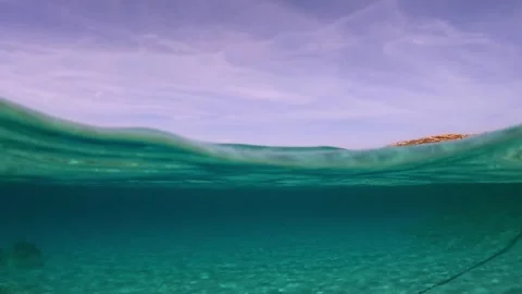 Half underwater view of sailing ship on horizon Stock Footage 277547705
