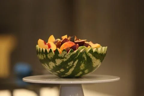 Half a watermelon filled with different berries Stock Photos