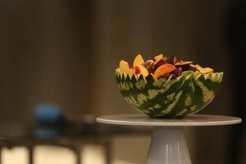 Half a watermelon filled with different berries Stock Photos