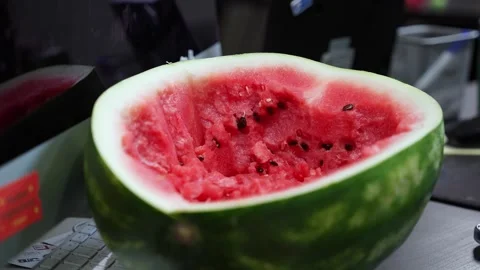 Half Watermelon On Modern Office Desk Stock Footage 334358723