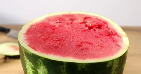 A half of watermelon. Red pulp of the fruit. Stock Footage 248790803