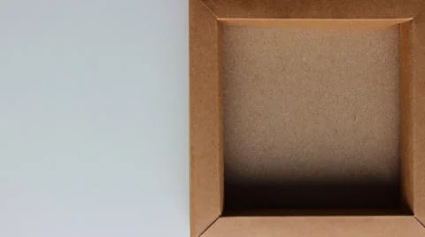 Half of the White Surface is Covered by a Flat Cardboard Box Stock Photos