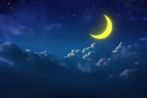 Half yellow moon behind cloudy on sky and star at night. Outdoors at night. l Photos