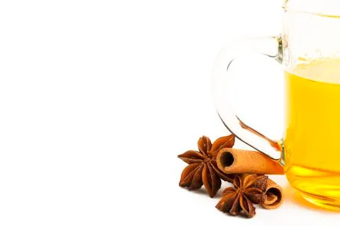 Half yellow tea two cinnamon sticks and two star anise Stock Photos