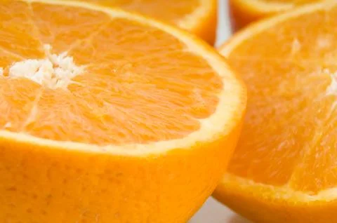 Halfs of fresh oranges makking pattern 스톡 사진
