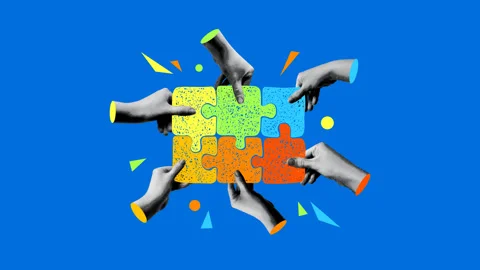 Halftone hands connect a puzzle. Concept of team building, teamwork Stock Footage 331216466