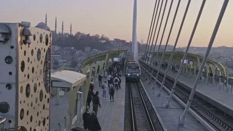 Haliç metro bridge, rail systems and city traffic, a train goes on the rails Stock Footage 221165807