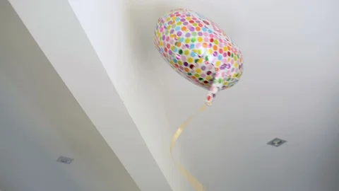 Halium inflatable flying party balloon slips from hands and hits ceiling 스톡 동영상 90805793