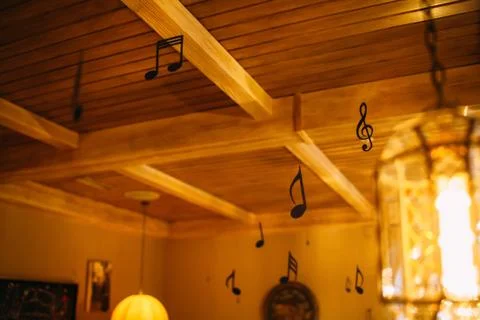 Hall decoration with hanging figures of notes Stock Photos