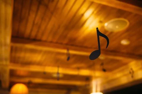 Hall decoration with hanging figures of notes Stock Photos