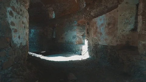 Hall of Old Tower Ruin with Sunrays Peaking through Wall | HD Stock Footage 88318659