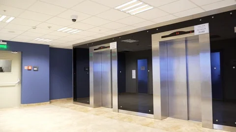 Hall with two elevators and exit door Stockbeeldmateriaal 128708941