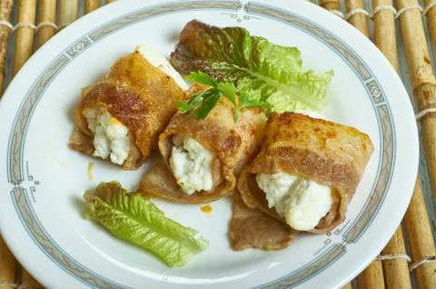 Halloumi  bacon rolls Fotos Stock
