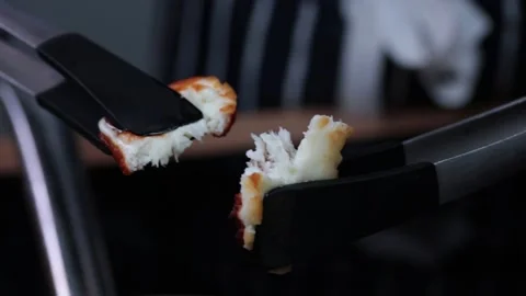 Halloumi cheese pulled apart in slow motion Stock Footage 166863321