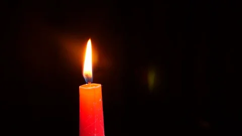 Halloween, 4k, slow-motion. A burning candle. A ghost appears behind the flame Stock Footage
