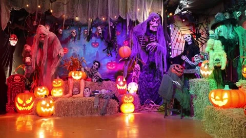 Halloween animatronics featuring a moving witch and giant skeleton Stock Footage 343945291
