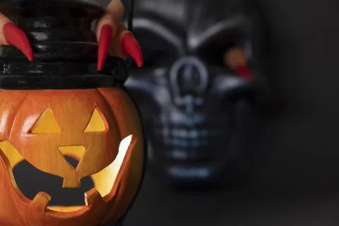 Halloween background. A close-up of glowing pumpkin with a carved face, with Stock Photos