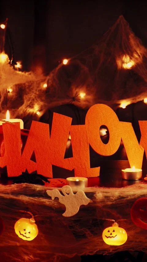 Halloween background with cobwebs, lighting pumpkins and skeleton.Vertical video Stock Footage 317198800