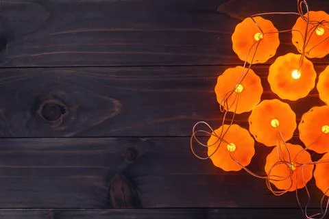 Halloween background, Pumpkin String Lights On Wooden Table Stock Photos