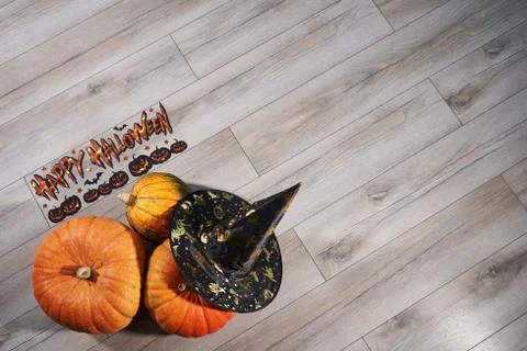 Halloween background with pumpkins and hat Stock Photos