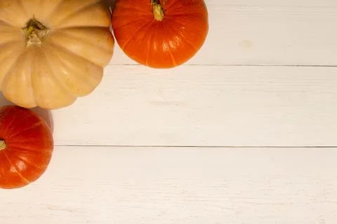 Halloween background with pumpkins. Flat lay. Frame with Halloween figures Stock Photos