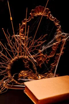 Halloween book composition, spider web, old vintage frame on a black background Stock Photos