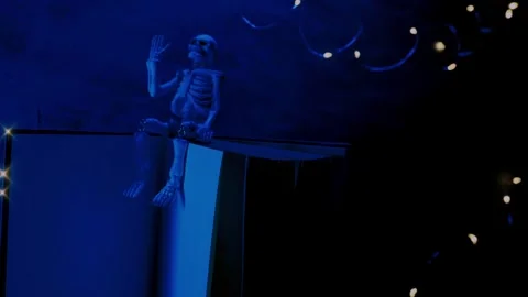 Halloween Book Mockup.Skeleton in the flickering light of garlands Stock Footage 314669831