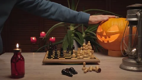 Halloween chess game with glowing pumpkin Stock Footage 319984422