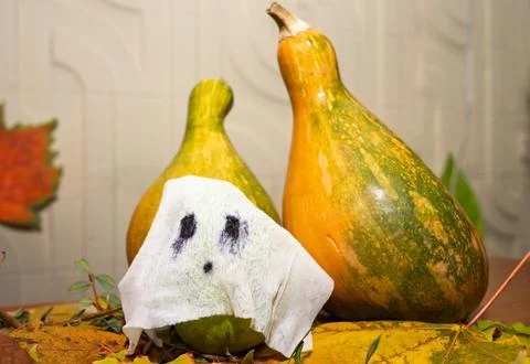 Halloween composition with pumpkin and ghost Stock Photos