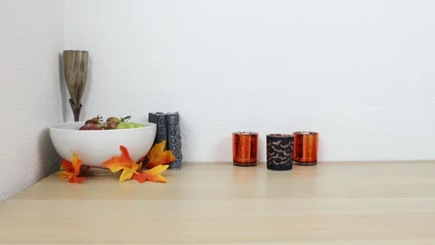 Halloween decor on a table with white background, establishing shot Stock Footage 285197834